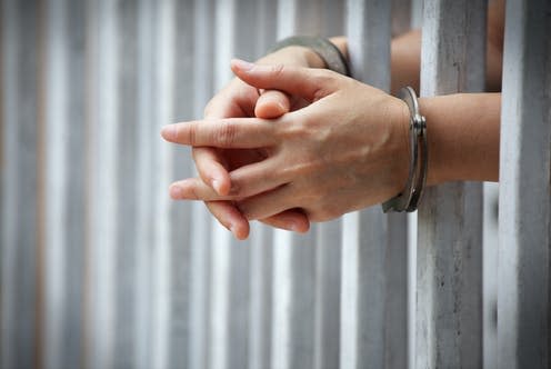   <span class="attribution"><a class="link " href="https://www.shutterstock.com/image-photo/close-prisoner-hands-jail-background-1031018551" rel="nofollow noopener" target="_blank" data-ylk="slk:Sakhorn/Shutterstock;elm:context_link;itc:0;sec:content-canvas">Sakhorn/Shutterstock</a></span>