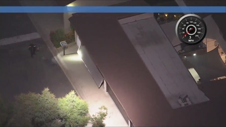 Police searched a garage as the man was believed to be hiding inside a residence at the apartment complex in Sunland. (KTLA)