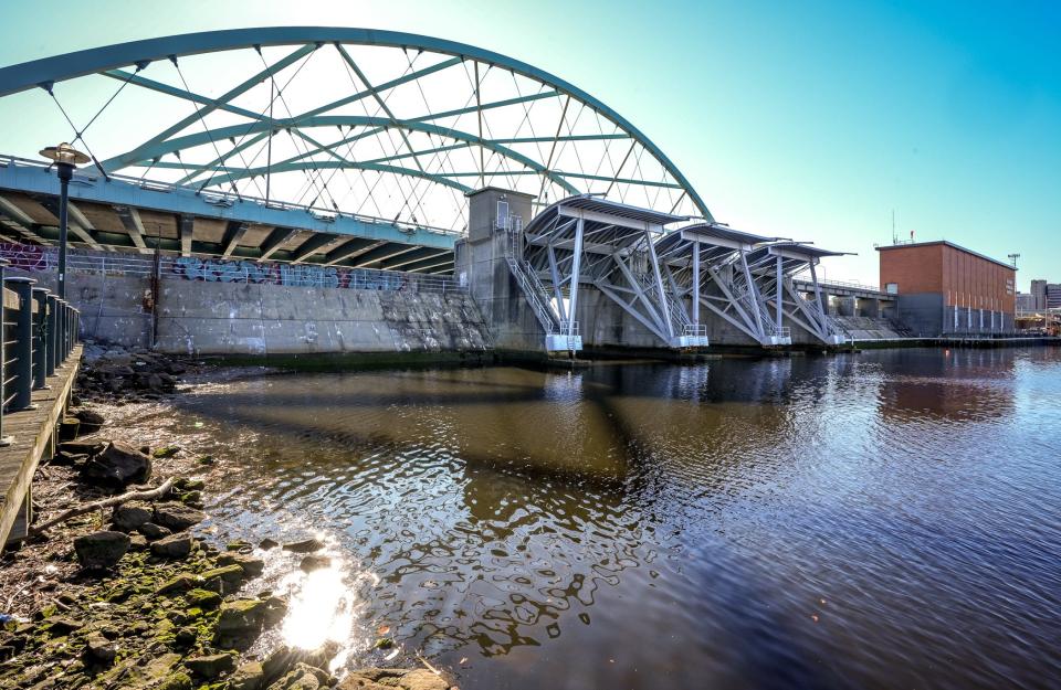 The Fox Point Hurricane Barrier, with the Interstate 195 Providence River Bridge in the background.