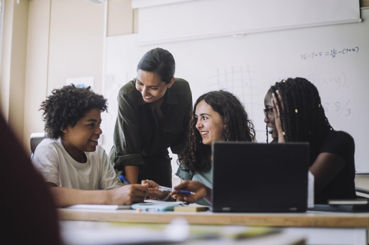 Building a sense of community is critical for students to thrive. <a href="https://www.gettyimages.com/detail/photo/happy-female-teacher-talking-with-junior-high-royalty-free-image/1439953744?phrase=students+speaking&adppopup=true" rel="nofollow noopener" target="_blank" data-ylk="slk:Maskot / Getty Images;elm:context_link;itc:0;sec:content-canvas" class="link ">Maskot / Getty Images</a>