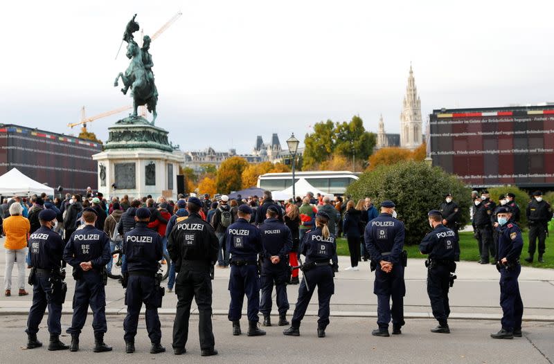 Demonstrators gather to protest against restrictions in Vienna