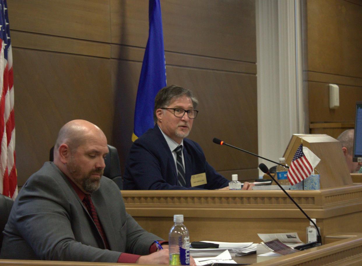 Outagamie County Board member Dan Gabrielson, right, takes the board chair seat after being unanimously elected to the position on Tuesday.