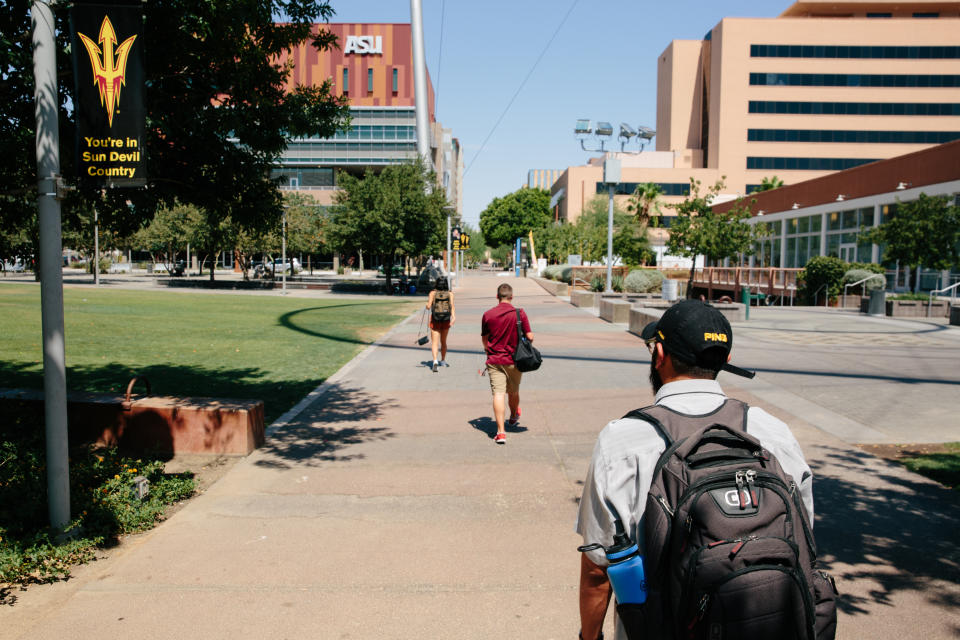 Edder Díaz Martinez walks through the downtown campus of Arizona State University on June 14. (Photo: Caitlin O’Hara for Yahoo News)