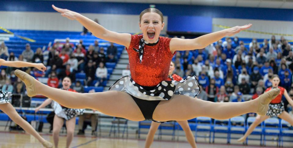 A ROCORI dancer leaps in the air during its high kick routine at the Central Lakes Conference dance meet at Apollo High School on Friday, Dec. 3, 2021. 