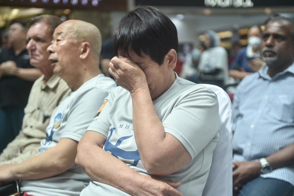 A relative reacts during an event held by relatives of the passengers and supporters to mark the 10th year since the Malaysia Airlines flight MH370 carrying 239 people disappeared from radar screens on March 8, 2014 while en route from Kuala Lumpur to Beijing, in Subang Jaya on March 3, 2024. (Photo by Arif Kartono / AFP) (Photo by ARIF KARTONO/AFP via Getty Images)