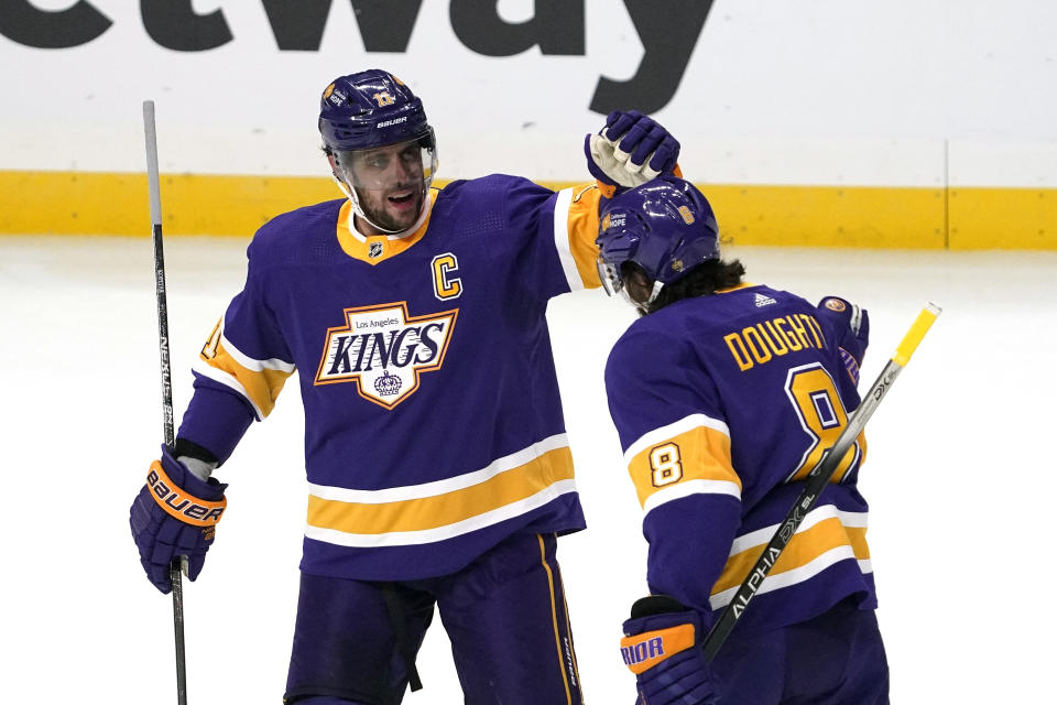 Los Angeles Kings defenseman Drew Doughty, right, celebrates his goal with center Anze Kopitar during the first period of an NHL hockey game against the St. Louis Blues Wednesday, March 17, 2021, in Los Angeles. (AP Photo/Mark J. Terrill)