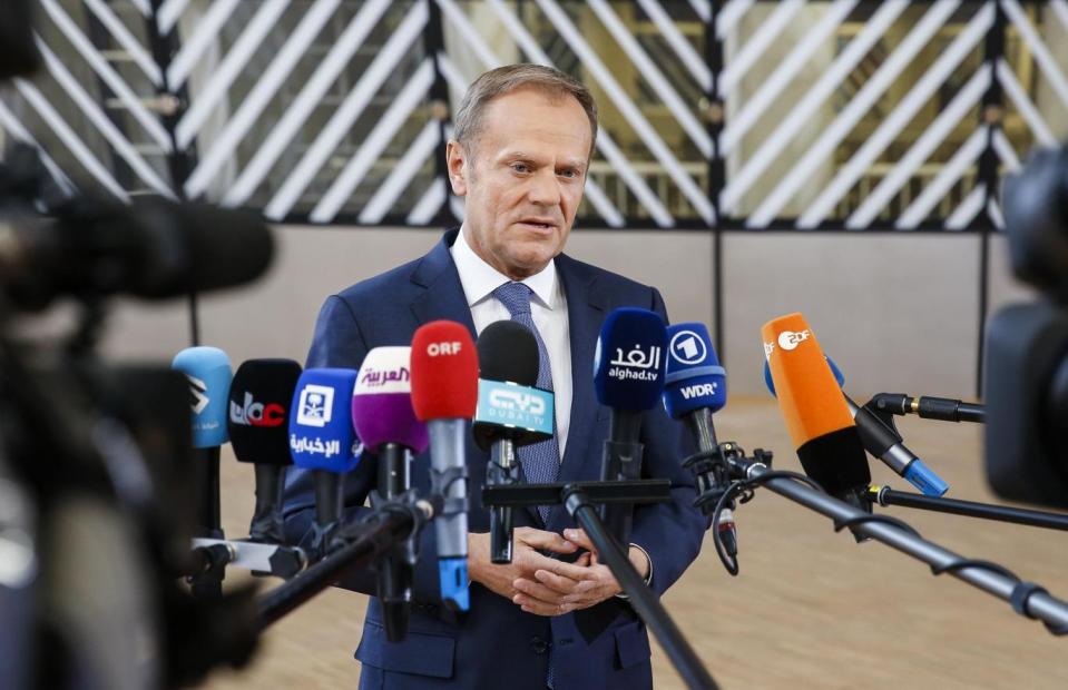 Donald Tusk speaks to the media as he arrives for a special European Summit in Brussels (EPA)