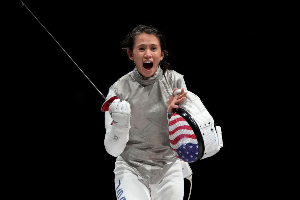 Lee Kiefer of the United States celebrates winning the women's individual Foil final competition against Inna Deriglazova of the Russian Olympic Committee at the 2020 Summer Olympics, Sunday, July 25, 2021, in Chiba, Japan.