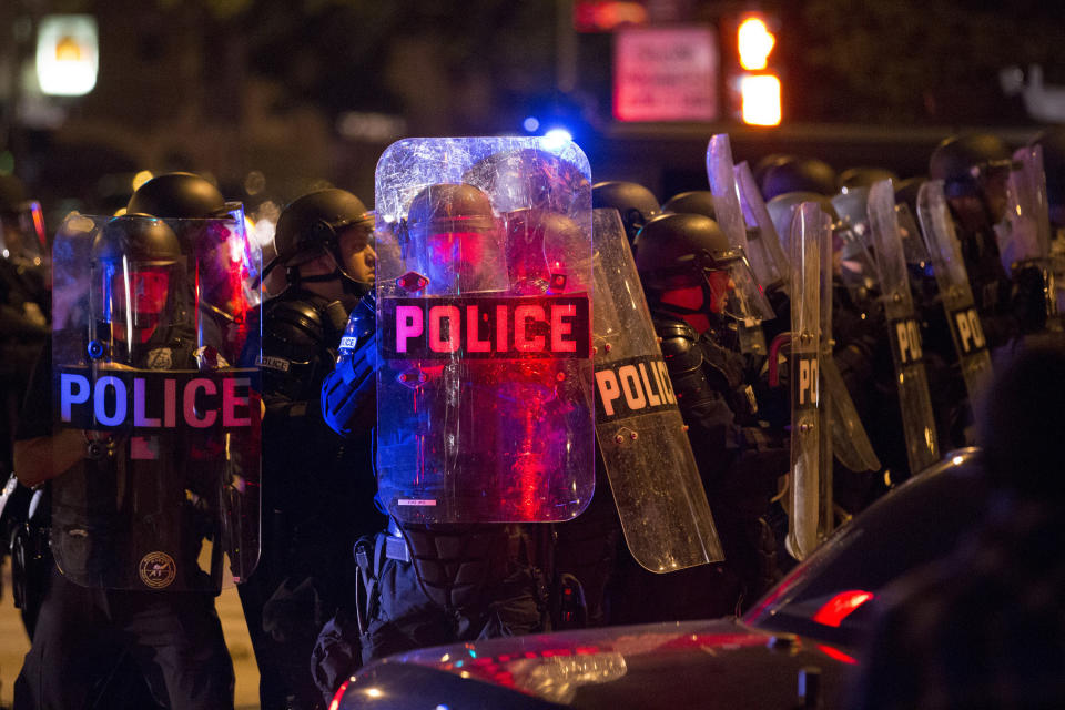 Police respond to a protest after rioters threw rocks and bottles in the unrest following a fatal police shooting in Milwaukee on Saturday. (Photo: Chicago Tribune via Getty Images)