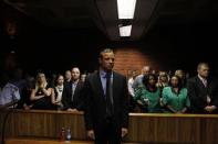 "Blade Runner" Oscar Pistorius awaits the start of court proceedings in the Pretoria Magistrates court February 19, 2013. REUTERS/Siphiwe Sibeko