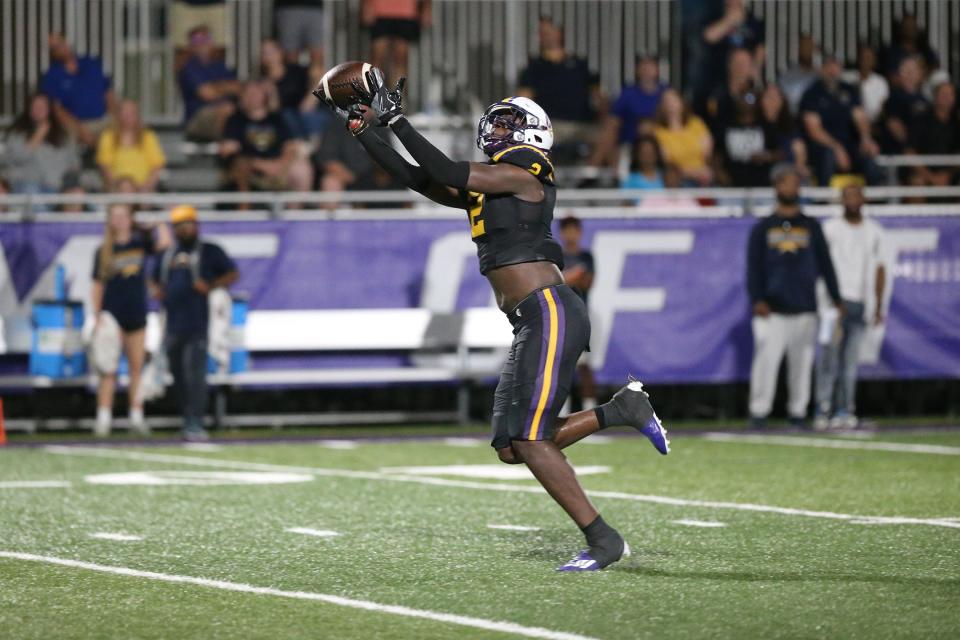 Calvary receiver Michael Smith hauls in a Jake Merklinger pass and sprints to the end zone for a 73-yard touchdown to take a 28-21 lead over Eagle's Landing on Sept. 2.