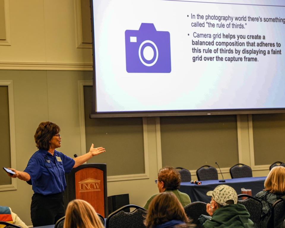 Ellen Sheehan giving a lecture workshop at the North Carolina sea turtle symposium on the proper way to photograph sea turtles.