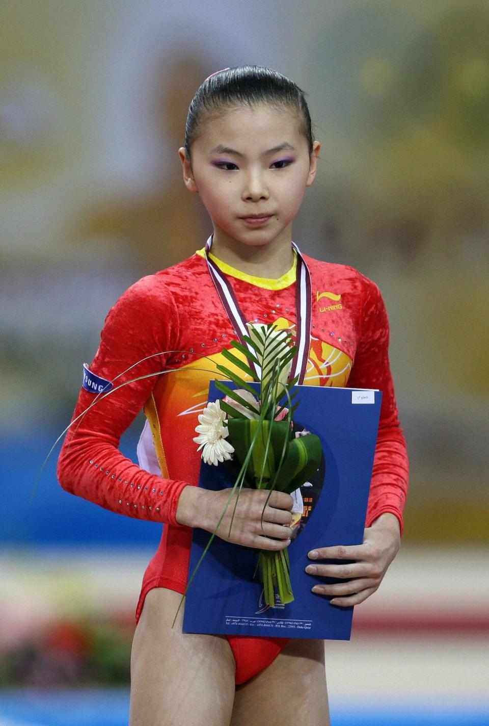 chinese gymnast he kexin wears her gold