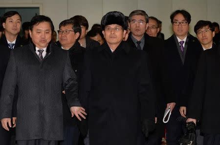 Members of the North Korean delegation arrive at the South's CIQ (Customs, Immigration and Quarantine), just south of the demilitarized zone separating the two Koreas in Paju, January 25, 2018. KOREA Pool/Yonhap via REUTERS/Files