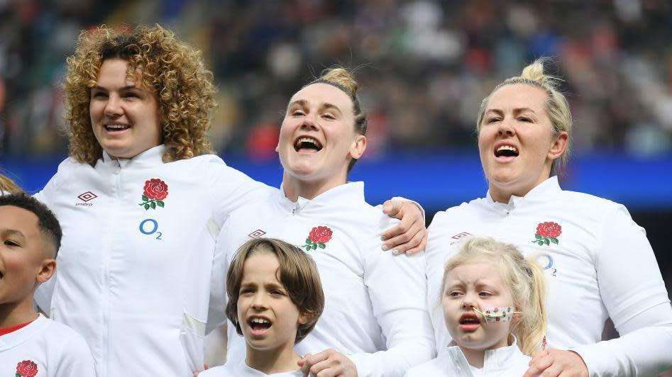 Ellie Kildunne and Megan Jones sing the national anthem