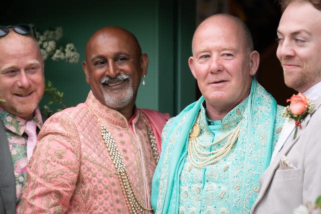 Clive Gillmor and Manoj Malde, both centre, are married