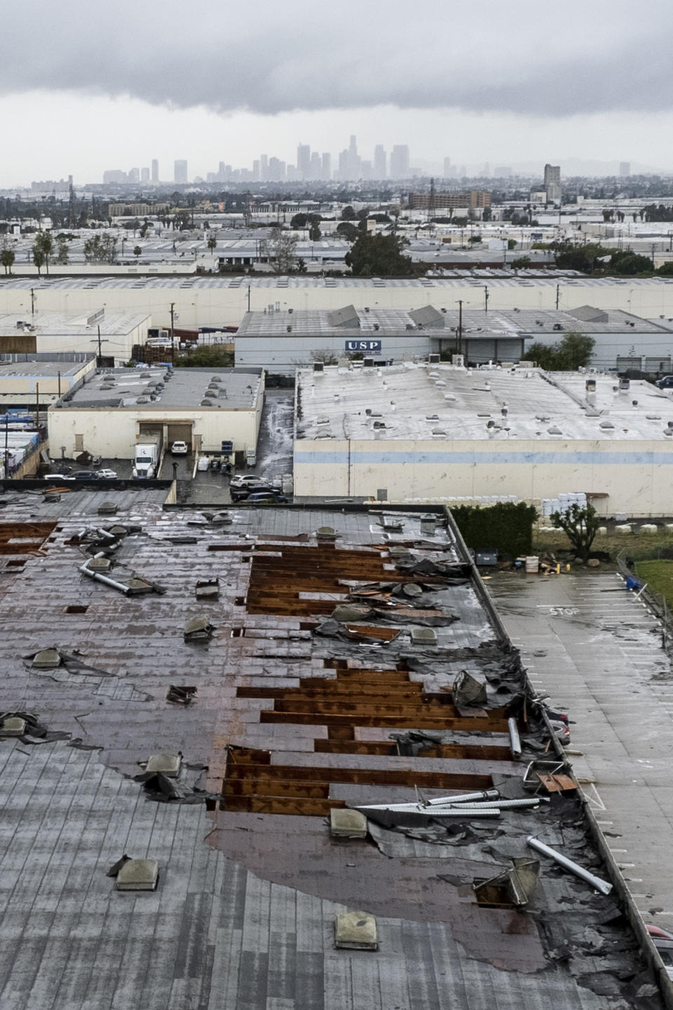 Damage to a building is seen on Wednesday, March 22, 2023 in Montebello, Calif., after a possible tornado. (AP Photo/Ringo H.W. Chiu)