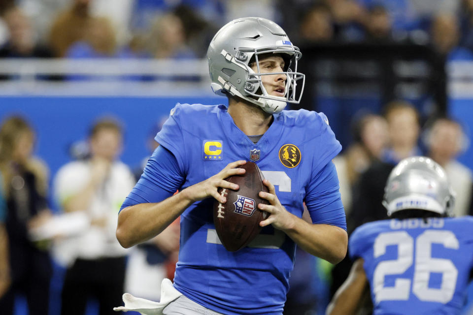 Detroit Lions quarterback Jared Goff looks to throw during the first half of an NFL football against the Green Bay Packers, Thursday, Nov. 23, 2023, in Detroit. (AP Photo/Duane Burleson)