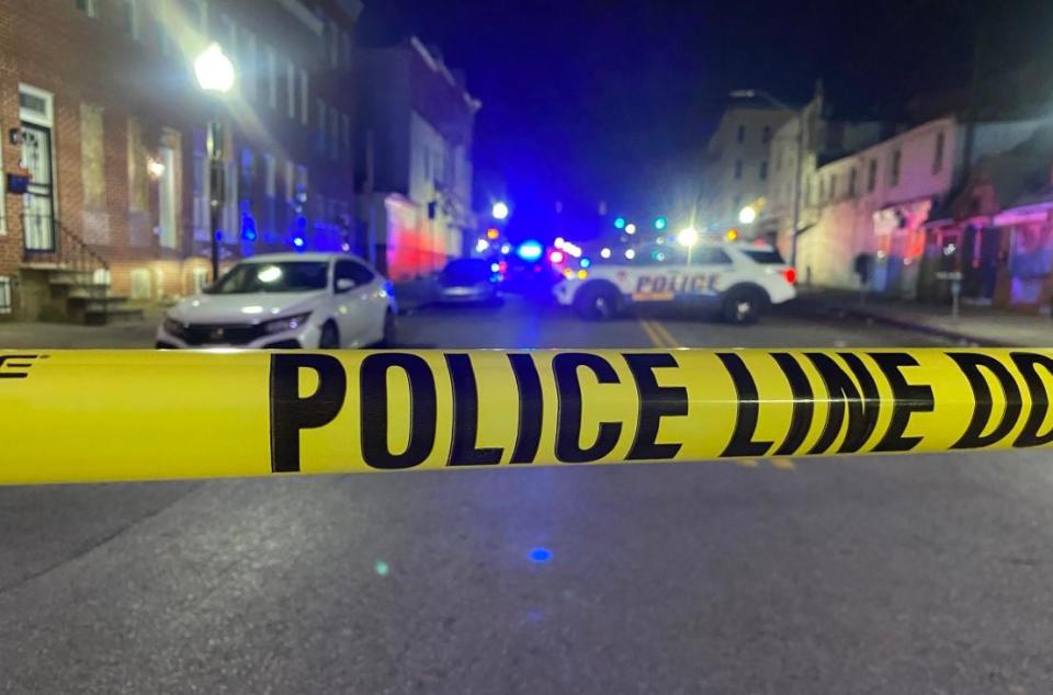 At the scene of a shooting and car crash in Baltimore, Maryland, in which at least one man was killed and several others were hurt. Jan. 28, 2023.  / Credit: Dennis Valera/CBS Baltimore