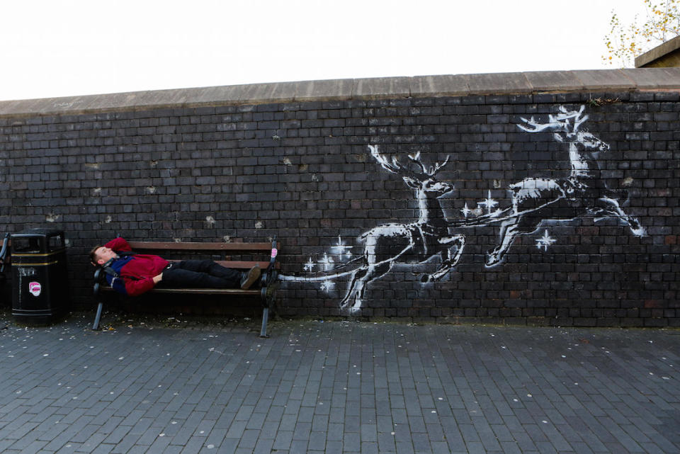 The mural shows reindeer pulling a bench in an effort to highlight homelessness (Picture: SWNS)