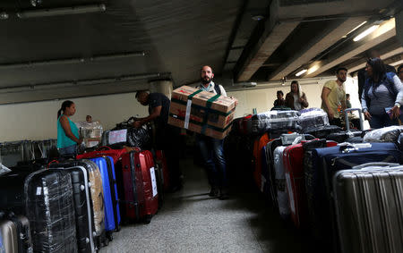 Cuban doctors return to their home, after criticism by Brazil's President-elect Jair Bolsonaro prompted Cuba's government to sever a cooperation agreement, in Brasilia, Brazil November 22, 2018. REUTERS/Adriano Machado