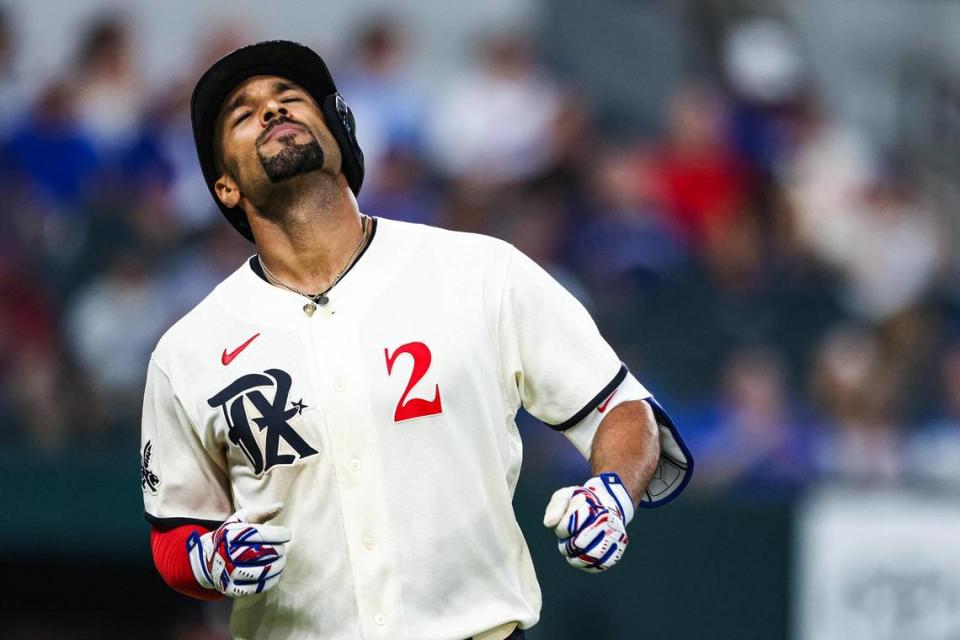 Texas Rangers infielder Marcus Semien (2) shows disappointment after popping up in the seventh inning of a regular season match up against the Los Angeles Dodgers at Globe Life Field in Arlington, Texas on Saturday, July 22, 2023. The Rangers gave up 18 hits and lost 16-3.