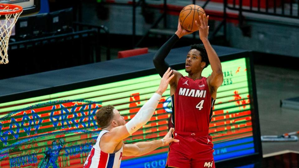 Miami Heat forward KZ Okpala (4) shoots over Detroit Pistons forward Blake Griffin (23) in the first quarter of a NBA basketball game at AmericanAirlines Arena on Jan. 16, 2021.