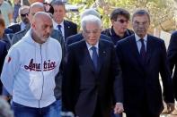 Italian President Sergio Mattarella (C) is seen with Amatrice mayor Sergio Pirozzi (L) during his visit to Amatrice after the earthquake in central Italy August 27, 2016. REUTERS/Ciro De Luca