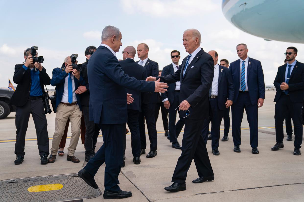 President Joe Biden is greeted by Israeli Prime Minister Benjamin Netanyahu after arriving at Ben Gurion International Airport, Wednesday, Oct. 18, 2023, in Tel Aviv.