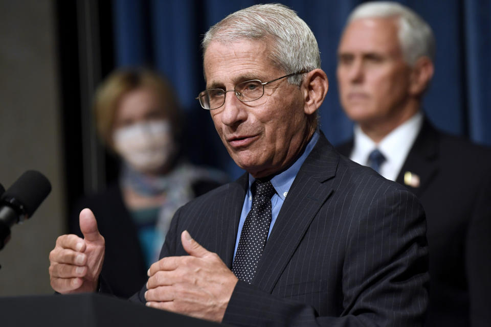 FILE - In this June 26, 2020, file photo Director of the National Institute of Allergy and Infectious Diseases Dr. Anthony Fauci, center, speaks as Vice President Mike Pence, right, and Dr. Deborah Birx, White House coronavirus response coordinator, left, listen during a news conference with members of the Coronavirus task force at the Department of Health and Human Services in Washington. Fauci has warned that the United States could soon see 100,000 infections per day. “We haven’t even begun to see the end of it yet,” Fauci said during a talk hosted by Stanford University’s School of Medicine. (AP Photo/Susan Walsh, File)