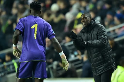 Cameroon coach Clarence Seedorf instructs goalkeeper Andre Onana during a 1-0 friendly loss to Brazil in England last November