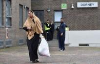 Residents are evacuated from the Dorney Tower residential block as a precautionary measure following concerns over the type of cladding used on the outside of the building on the Chalcots Estate in north London, Britain, June 24, 2017. REUTERS/Hannah McKay