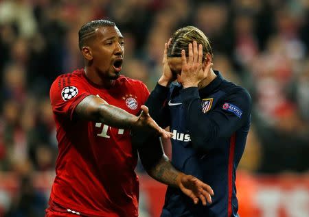 Britain Football Soccer - Bayern Munich v Atletico Madrid - UEFA Champions League Semi Final Second Leg - Allianz Arena, Munich - 3/5/16 Atletico Madrid's Fernando Torres looks dejected after having his penalty saved as Bayern Munich's Jerome Boateng celebrates Reuters / Michaela Rehle Livepic EDITORIAL USE ONLY.