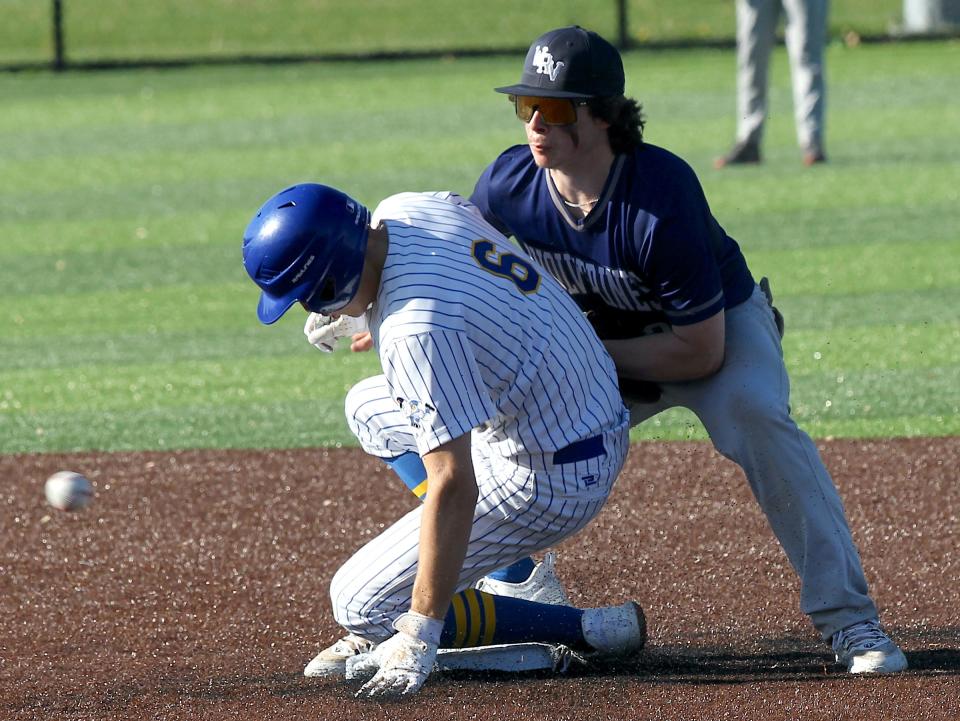 Mitchell's AJ Sarver (6) steals second as the White River Valley second baseman waits on the late throw on Wednesday, April 17, 2024.