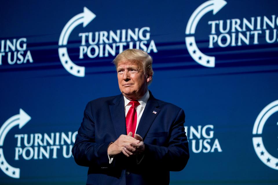 President Donald Trump takes the stage at the Turning Point USA Student Action Summit in December 2019.