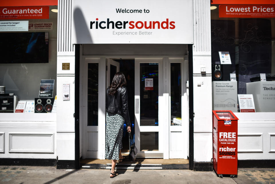 LONDON, ENGLAND - MAY 15: A woman enters a Richer Sounds branch on May 15, 2019 in London, England. Julian Richer, who founded the business in 1978, has announced he is handing over control of his business to employees in an employee-owned trust. More than 500 staff will also share a bonus of £3.5m as owner Julian Richer signs over 60 per cent of the company.(Photo by Peter Summers/Getty Images)