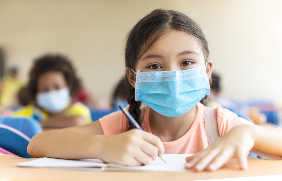 students wearing  mask and  studying in the classroom.