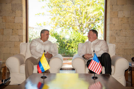 U.S. Secretary of State Mike Pompeo speaks with Colombian President Ivan Duque at the guesthouse in Cartagena, Colombia January 2, 2019. Courtesy of Colombian Presidency/Handout via REUTERS