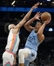 Memphis Grizzlies guard Desmond Bane (22) drives to the basket against San Antonio Spurs guard Derrick White (4) during the second half of an NBA basketball game, Wednesday, Jan. 26, 2022, in San Antonio. (AP Photo/Eric Gay)