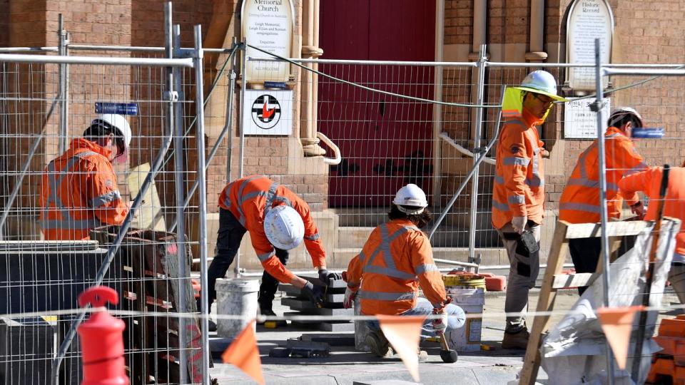 Construction workers are seen in Sydney