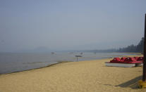 FILE - In this Sept. 6, 2021, file photo, smoke shrouds parts of Lake Tahoe visible from Ski Run Marina in downtown South Lake Tahoe, Calif. With wildfire no longer threatening Lake Tahoe, residents, tourists and scientists drawn to its clean alpine air, clear blue waters and fragrant pine trees now wonder about the long-term effects that will remain after wildfire season ends. (AP Photo/Samuel Metz,File)