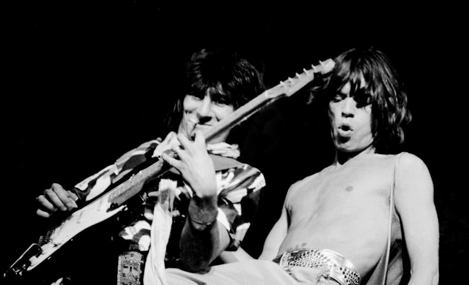 Rolling Stones guitarist Ron Wood and singer Mick Jagger performing at Knebworth in 1976. The Stones have been long-time fans of Fender’s Stratocaster guitars, which will no longer be made with ash due to climate change (Getty Images)