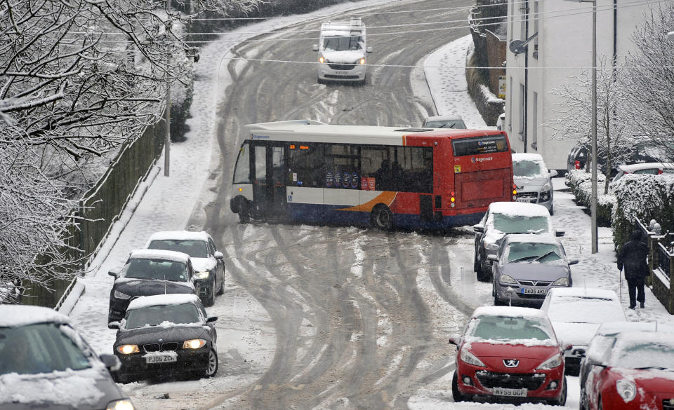 A bus struggles to deal with icy conditions on the roads (SWNS)