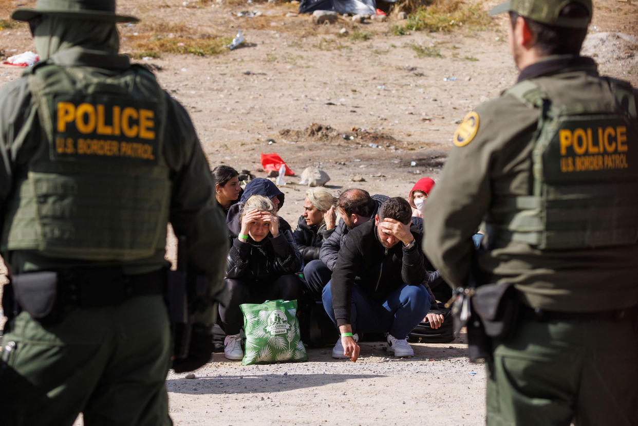 U.S. Border Patrol organize migrants after they gathered between primary and secondary border fences as the United States prepares to lift COVID-19 era Title 42 restrictions that have blocked migrants at the U.S.-Mexico border from seeking asylum since 2020 near San Diego, Calif., on May 9, 2023.