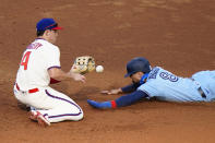 Toronto Blue Jays' Cavan Biggio, right, steals second past Philadelphia Phillies second baseman Scott Kingery during the third inning of the first baseball game in a doubleheader, Friday, Sept. 18, 2020, in Philadelphia. (AP Photo/Matt Slocum)