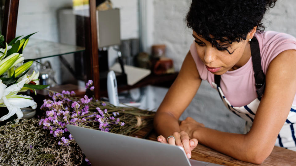 Woman Using Laptop Online Flower Shop.