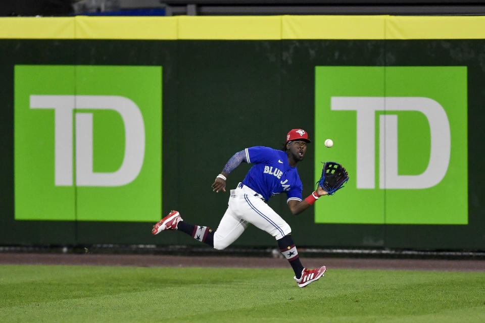 Toronto Blue Jays center fielder Jonathan Davis catches a fly ball hit by Tampa Bay Rays' Austin Meadows during the ninth inning of a baseball game in Buffalo, N.Y., Friday, July 2, 2021. (AP Photo/Adrian Kraus)