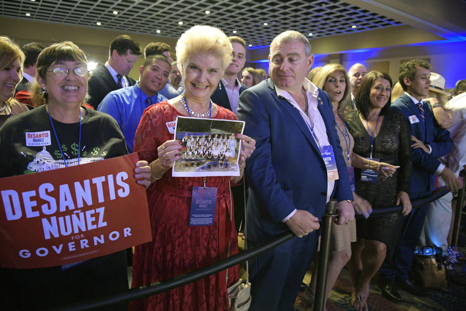 CORRECTS SPELLING TO FRUMAN, NOT FURMAN - FILE- In this Nov. 6, 2018 file photo, supporters of Florida gubernatorial candidate Ron DeSantis wait for results at his election party in Orlando, Fla. Standing in the middle of the front row is Lev Parnas. Parnas and his associate Igor Fruman are facing federal charges in connection to efforts by President Donald Trump's lawyer, Rudy Giuliani, to launch a Ukrainian corruption investigation against Joe Biden and his son, Hunter. (AP Photo/Phelan M. Ebenhack, File)