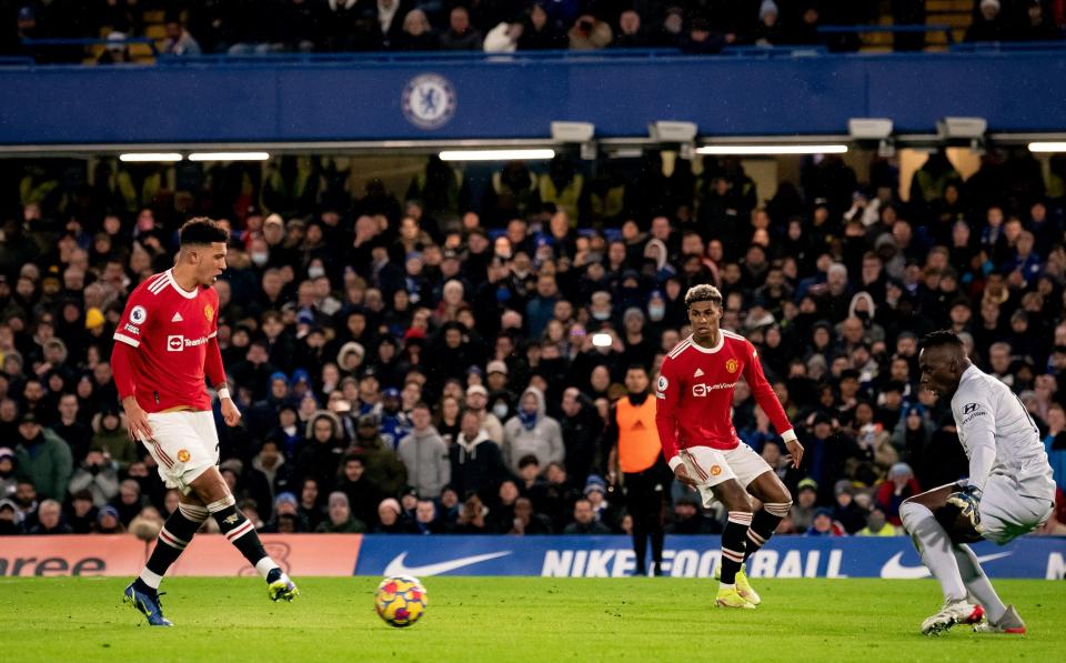 Jadon Sancho of Manchester United scores their first goal during the Premier League match between Chelsea and Manchester United at Stamford Bridge on November 28, 2021 in London, England. - GETTY IMAGES