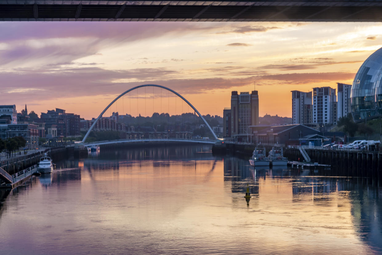 The bridges between Gateshead and Newcastle-upon-Tyne on the River Tyne with a stunning late summer sunrise.